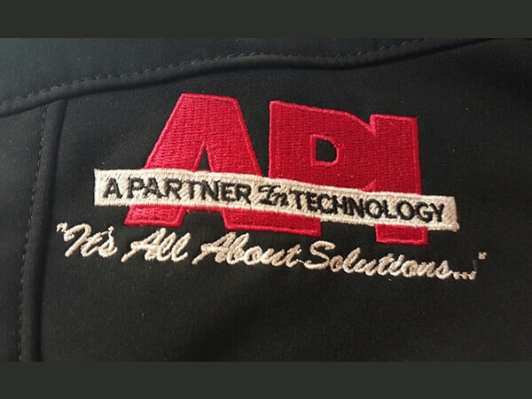 API Technology embroidered logo on jacket by D R Designs, LLC.