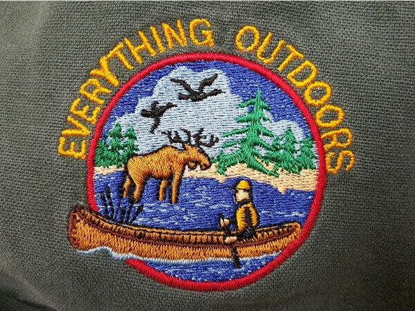 Everything Outdoors embroidered logo on jacket
