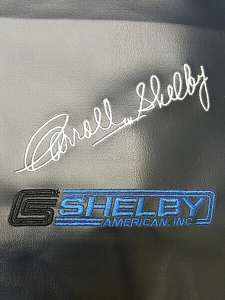 Shelby embroidered logo by D R Designs, LLC.